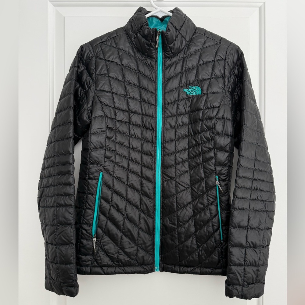 The North Face Women's Black Puffer Jacket with Teal Accents